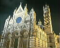 Brightly lit cathedral at night
